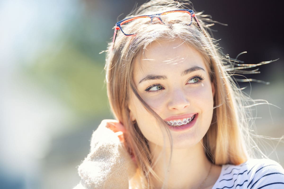 Girl With Braces What To Know When Getting Braces.jpg